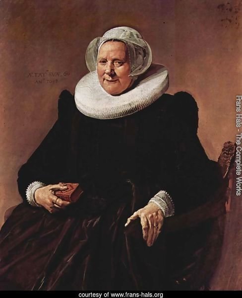 Portrait of a sitting, sixty year old woman with book in his right hand